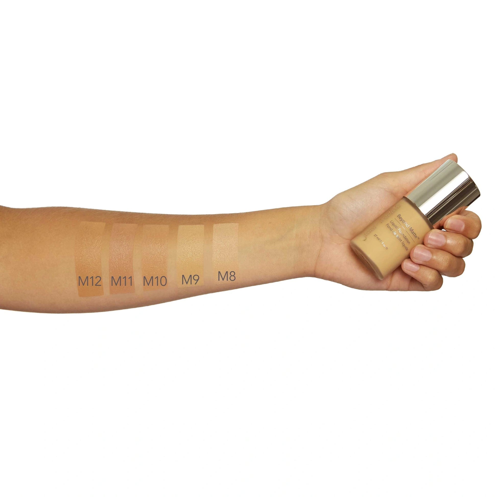 Jane Iredale Beyond Matte Liquid Foundation M10 27ml handholding foundation bottle with swatches on skin